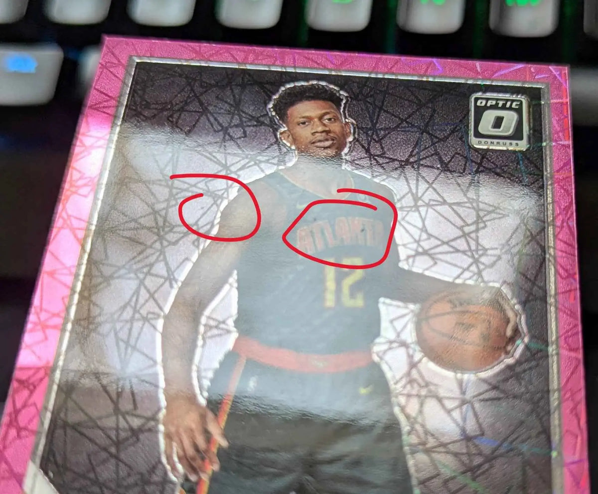 Pink-bordered optic 0 trading card featuring deandre hunter in an atlanta jersey from 2019-20 panini donruss optic pink velocity prizm rated rookie