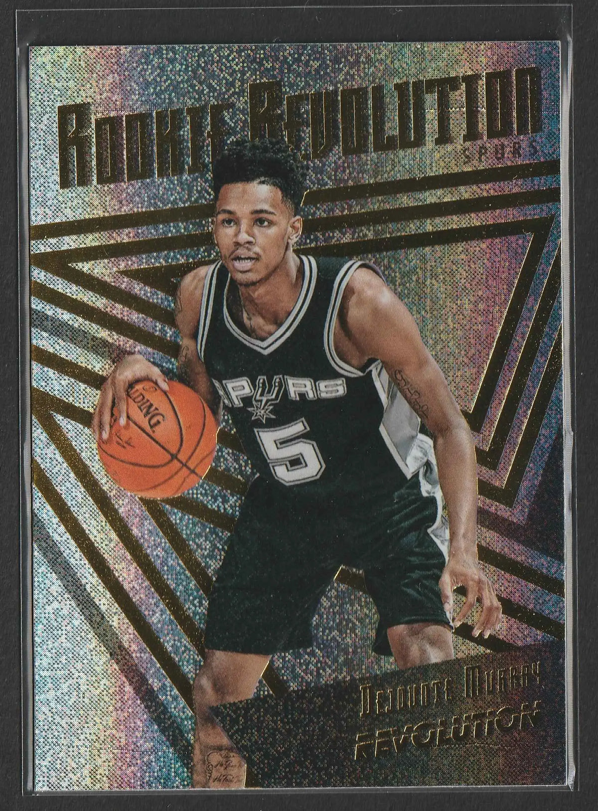 Black and silver san antonio spurs basketball trading card featuring demar derozan in action from rookie revolution series