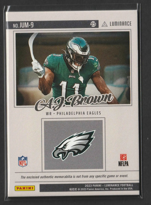 A green and white Philadelphia Eagles football trading card featuring A.J. Brown 2023 Panini Luminance Gold Jumbo Relics