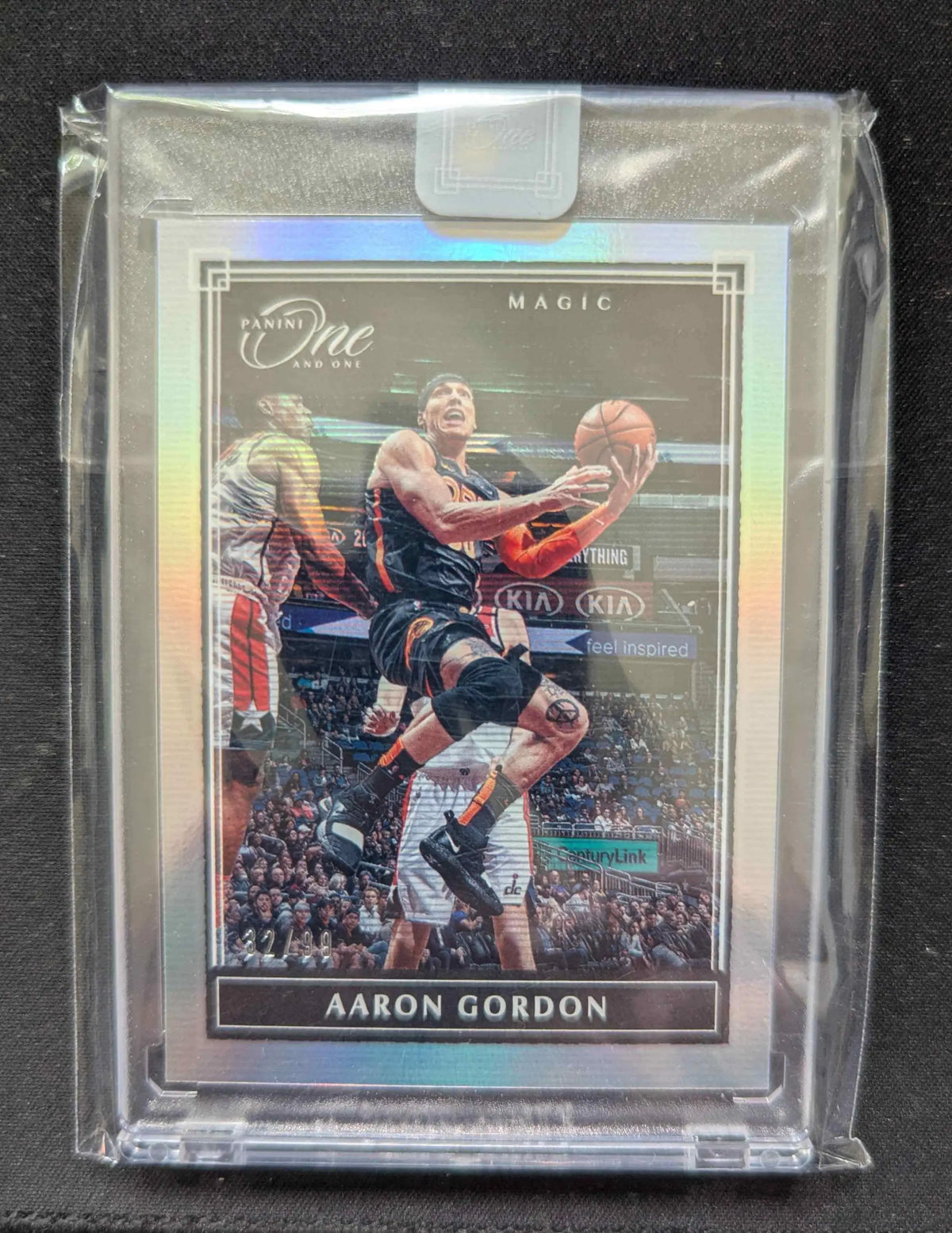 Silver holographic panini one and only basketball trading card featuring aaron gordon mid-air in clear protective sleeve