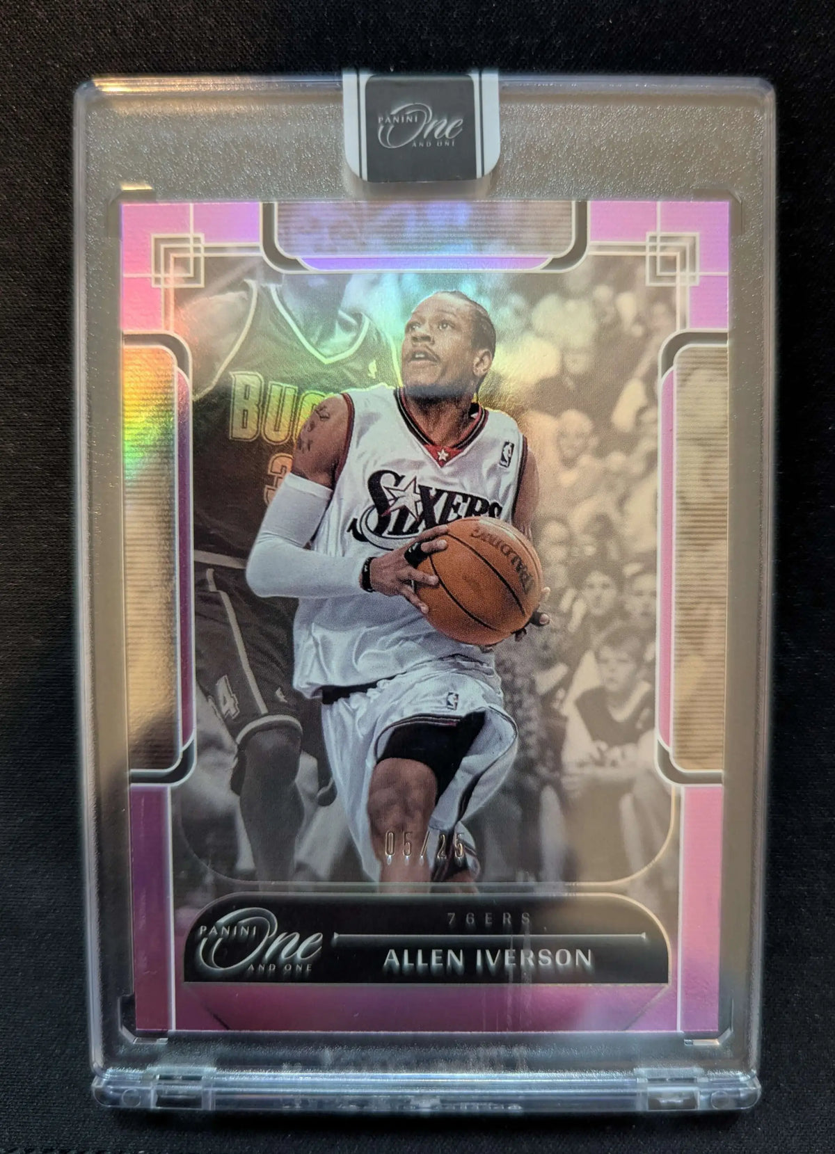 This allen iverson 2023-24 panini one and one purple refractor card features him in a white philadelphia 76ers jersey with iridescent pink and gold borders in protective packaging