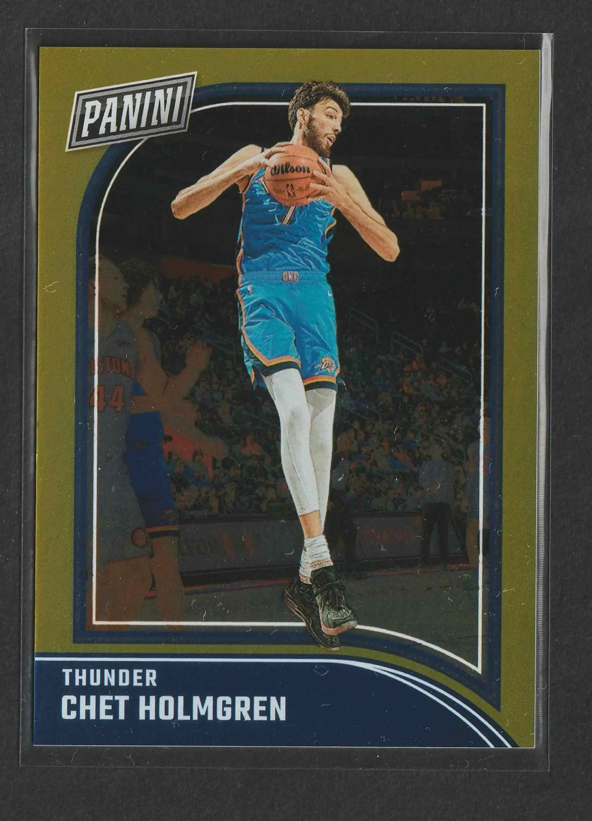 Chet holmgren basketball trading card in blue thunder jersey mid-air with wilson ball panini black friday gold 2024