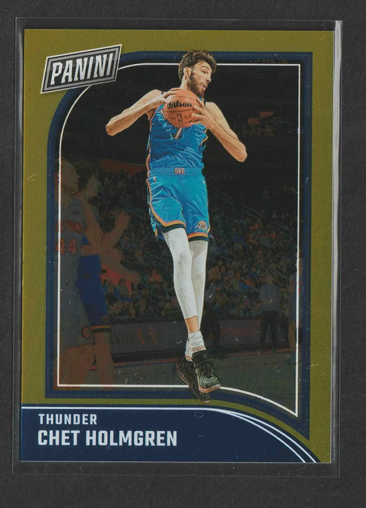 Chet holmgren basketball trading card in blue thunder jersey mid-air with wilson ball panini black friday gold 2024
