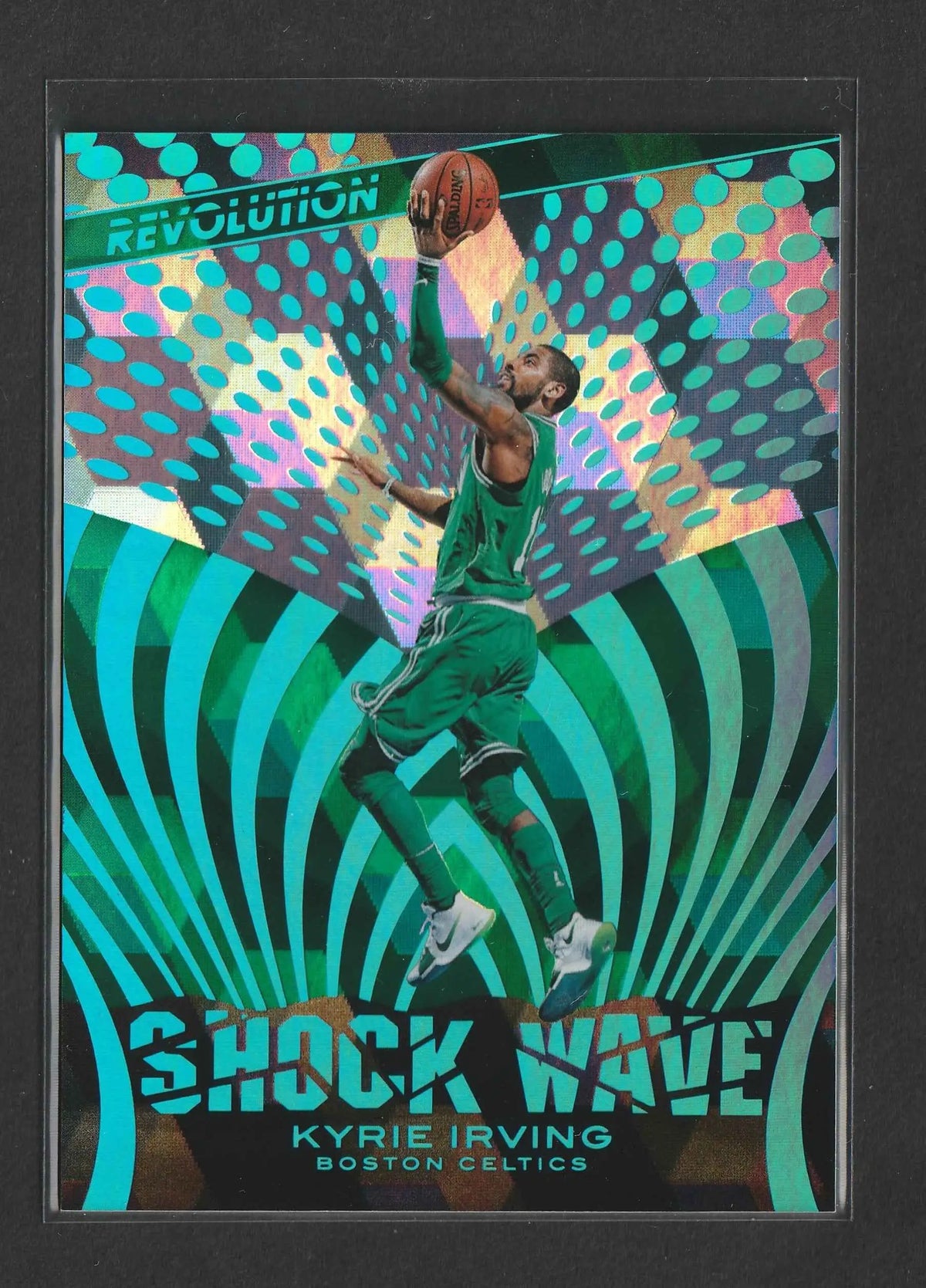 Ein lebhaft grüner und teal holografischer basketball trading card mit kyrie irving im boston celtics trikot in der luft